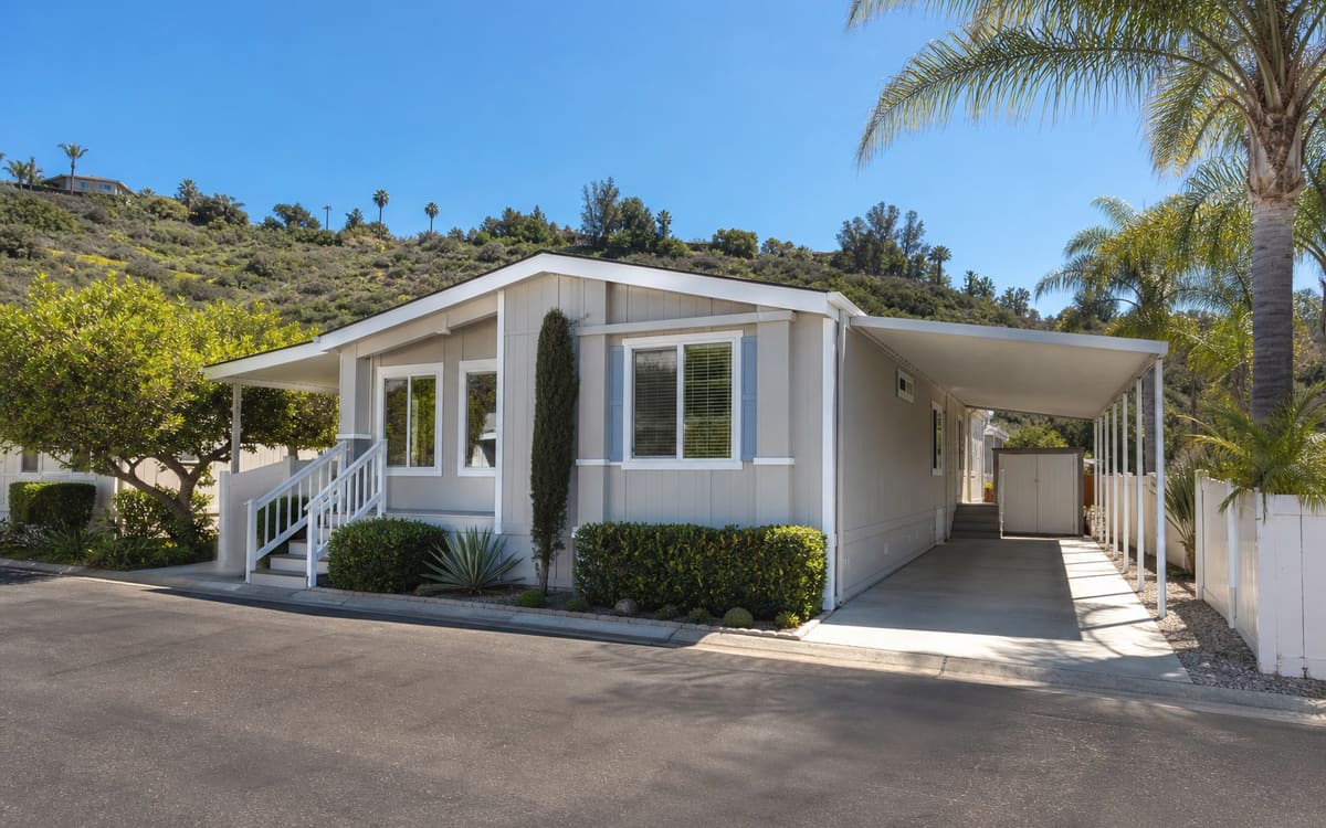 A tidy manufactured home in a South San Diego County community with coastal scrub hills