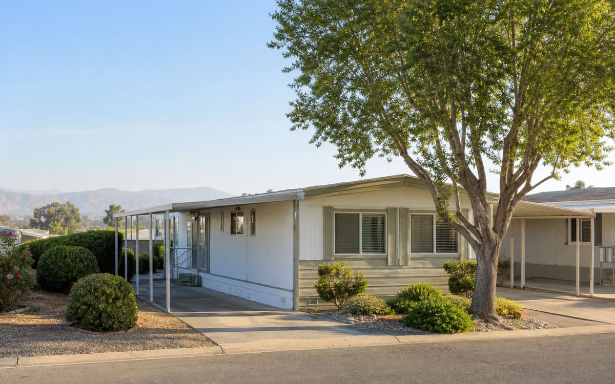 A manufactured home with a shade tree in a San Joaquin Valley neighborhood