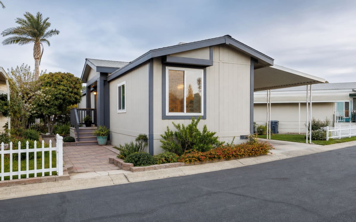 A compact, well-maintained manufactured home in an established urban Southern California community